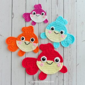 Four crochet fish with big eyes.