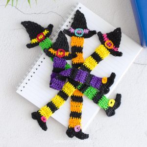 Four Halloween bookmarks with a witchy theme.