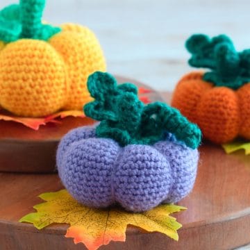 Purple amigurumi pumpkin.