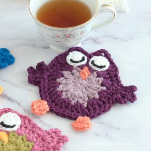 Purple crochet owl coaster.