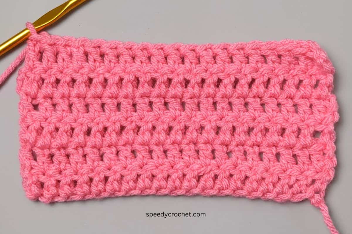 A crochet swatch made with double crochet stitches.