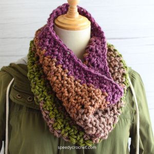 A multi colored crochet cowl.