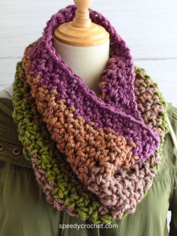 A multi colored crochet cowl.