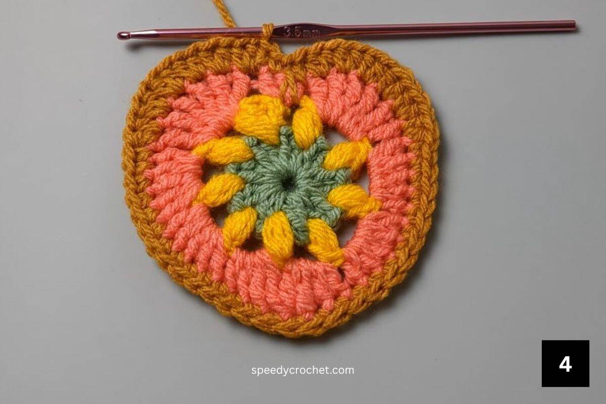 A multi colored crochet heart.