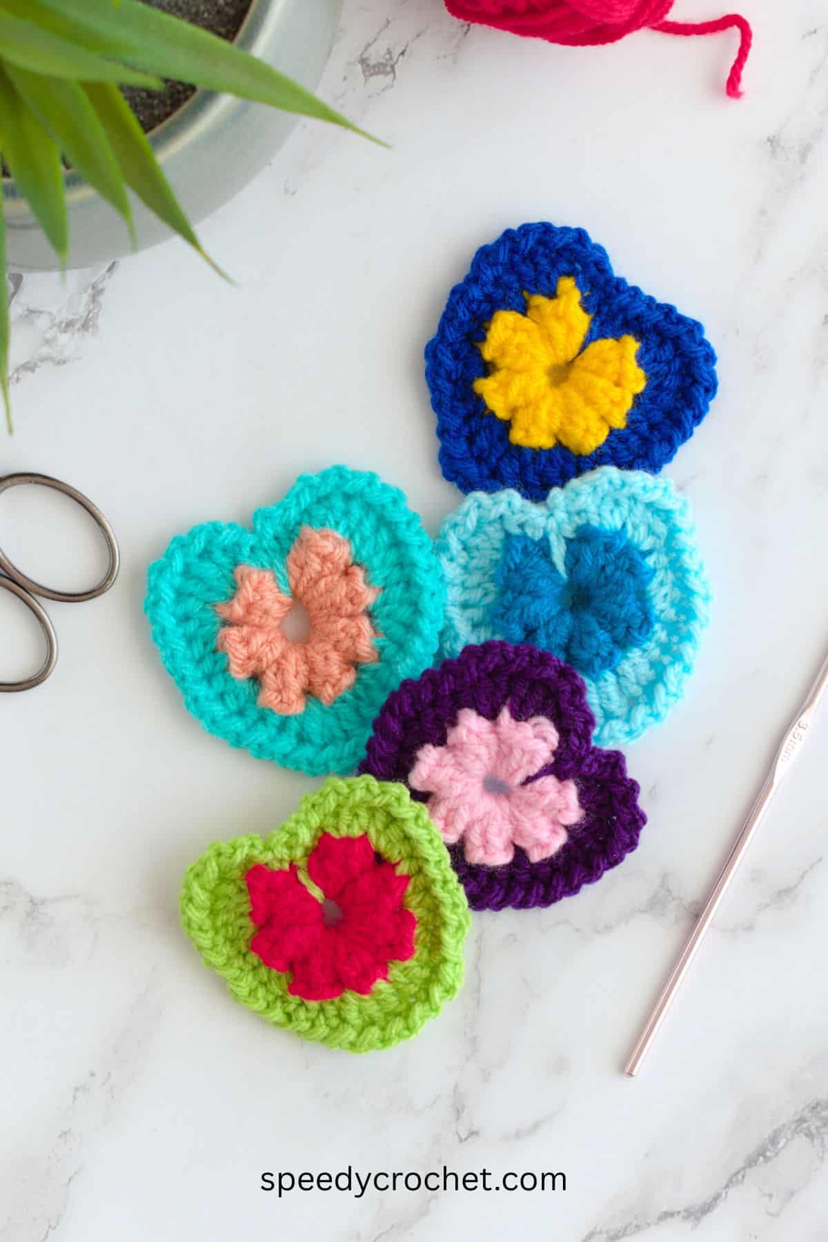 Five small crochet heats.