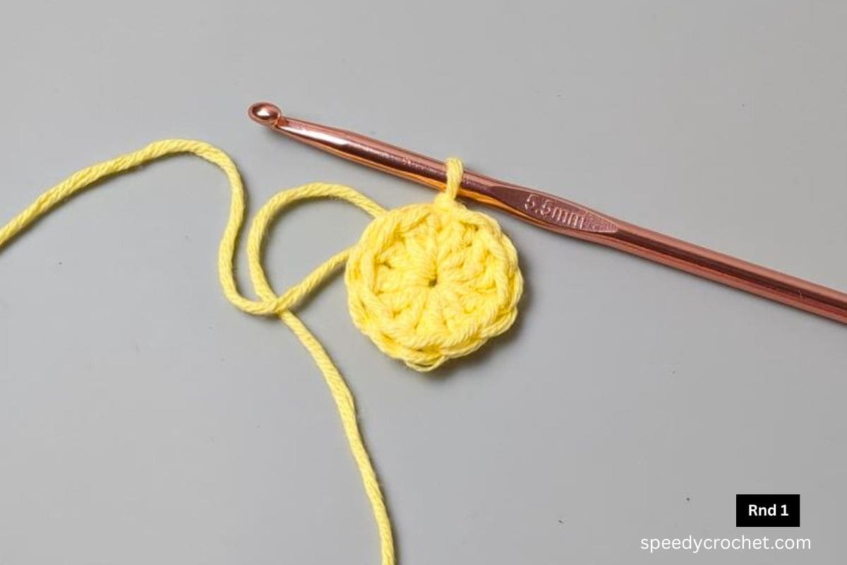 A yellow one round crochet circle.