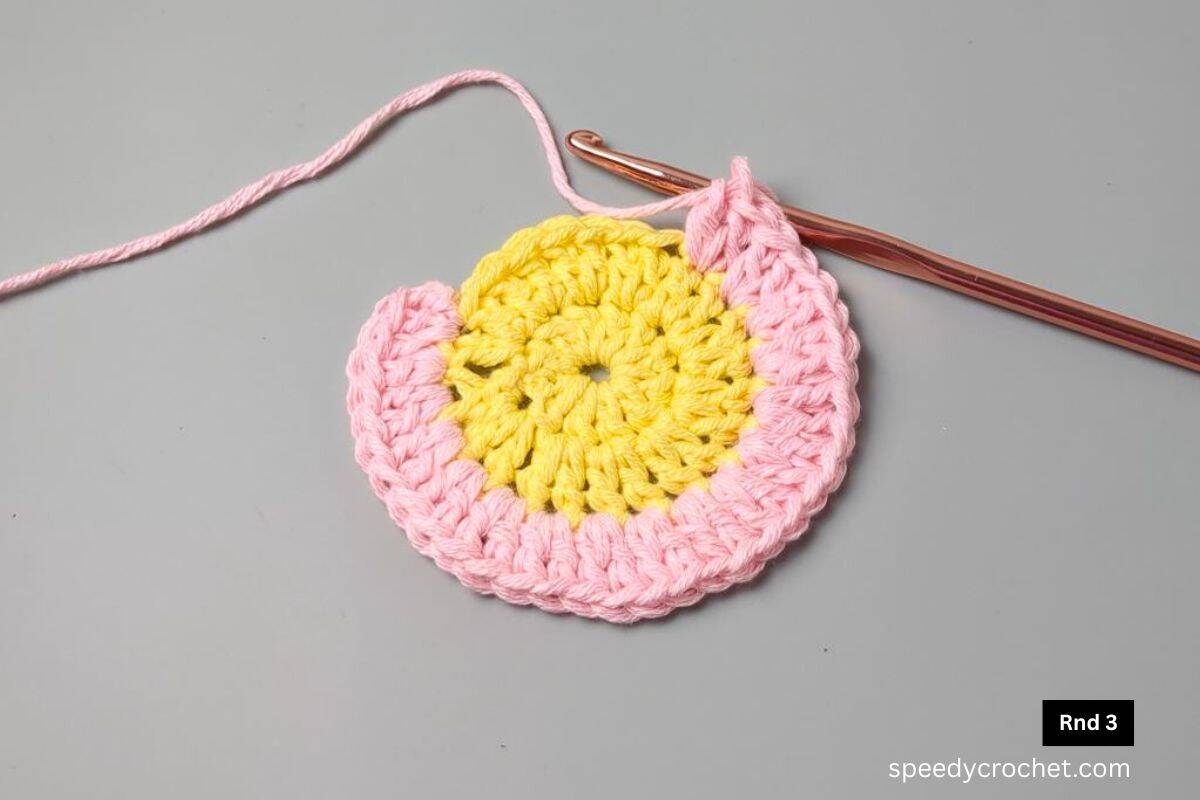 Yellow and pink crochet circle.