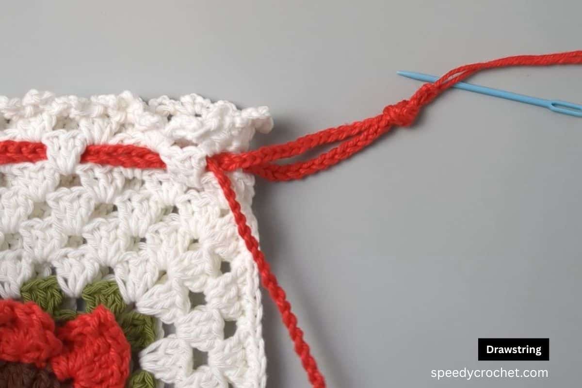 Closeup of drawstring pouch with ties.