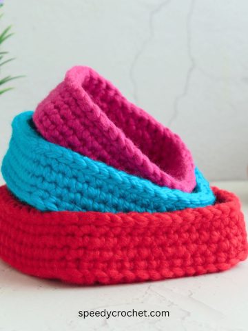 Red, blue and pink square crochet baskets.