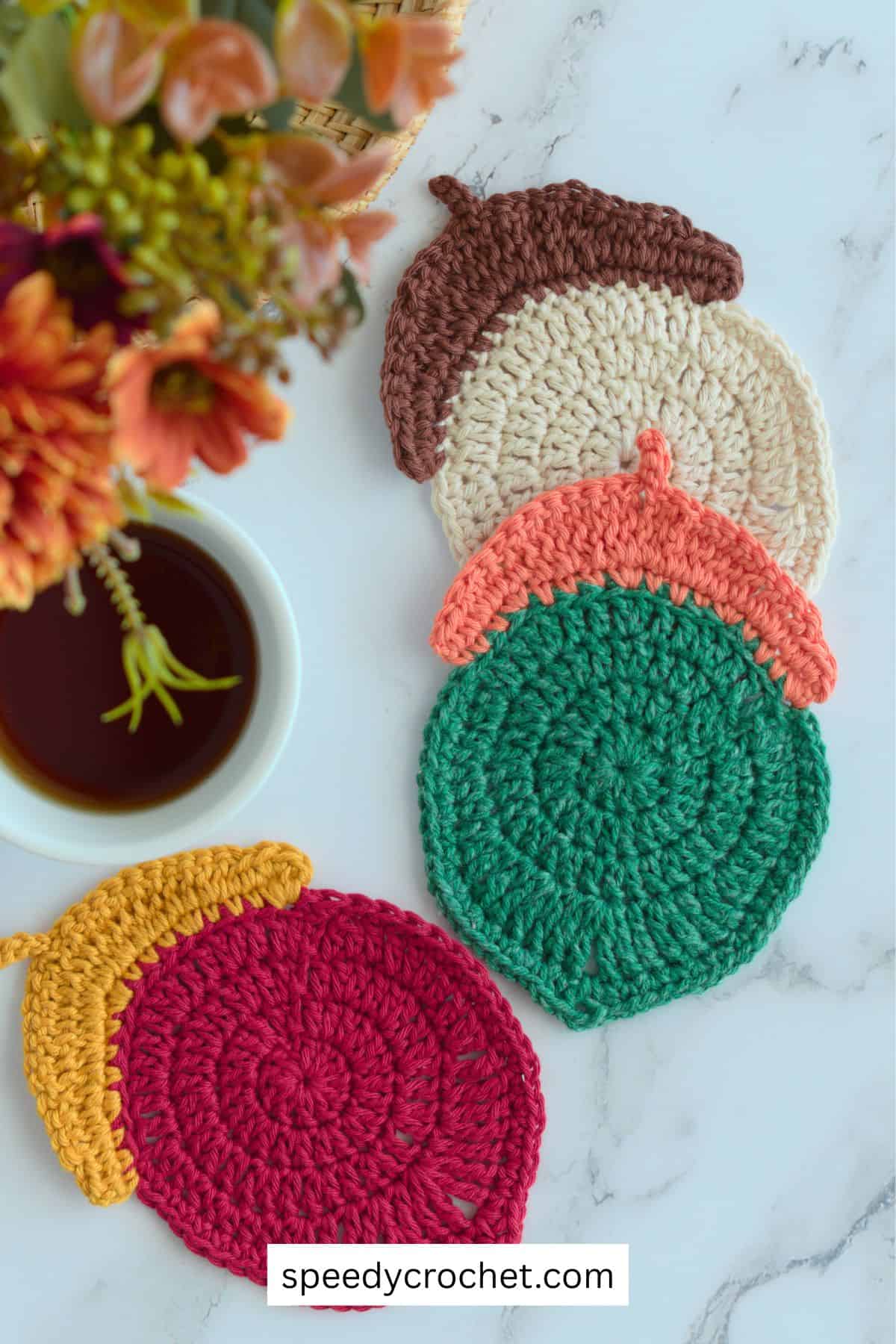 Three crochet acorn coasters.