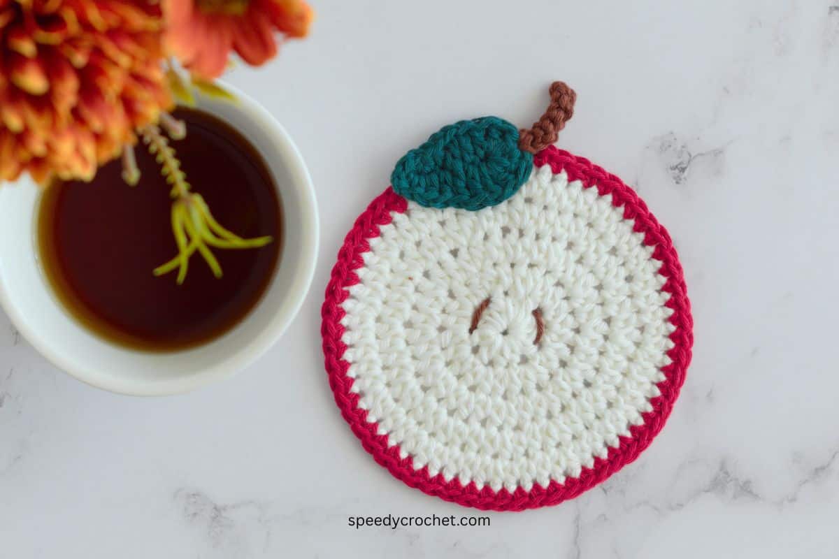Crochet apple coaster.