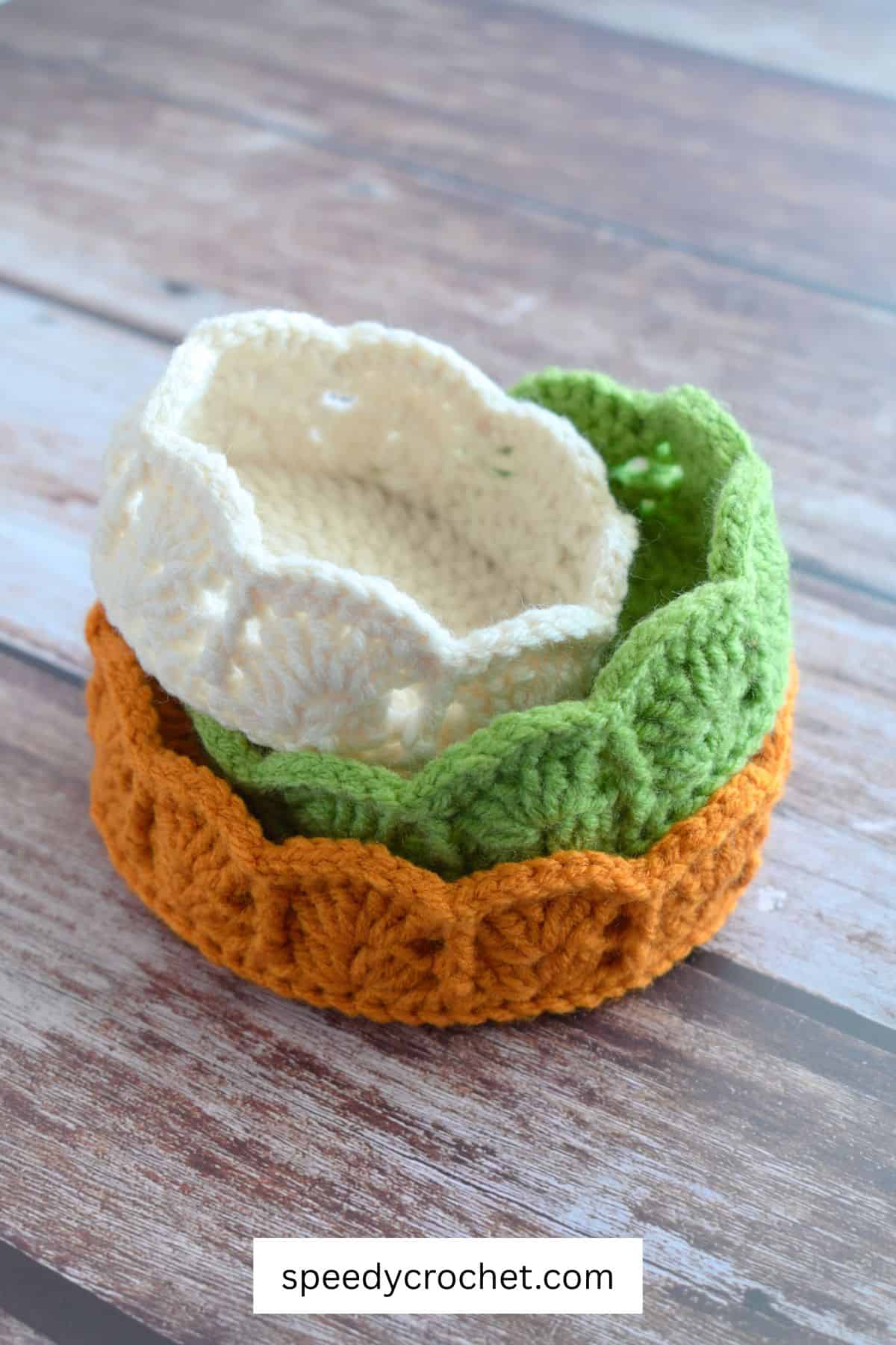 Three crochet baskets.
