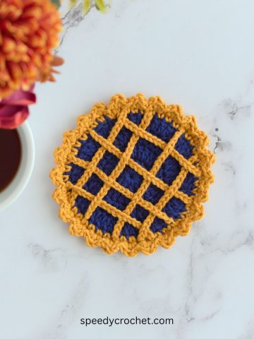 Blue crochet pie coaster.