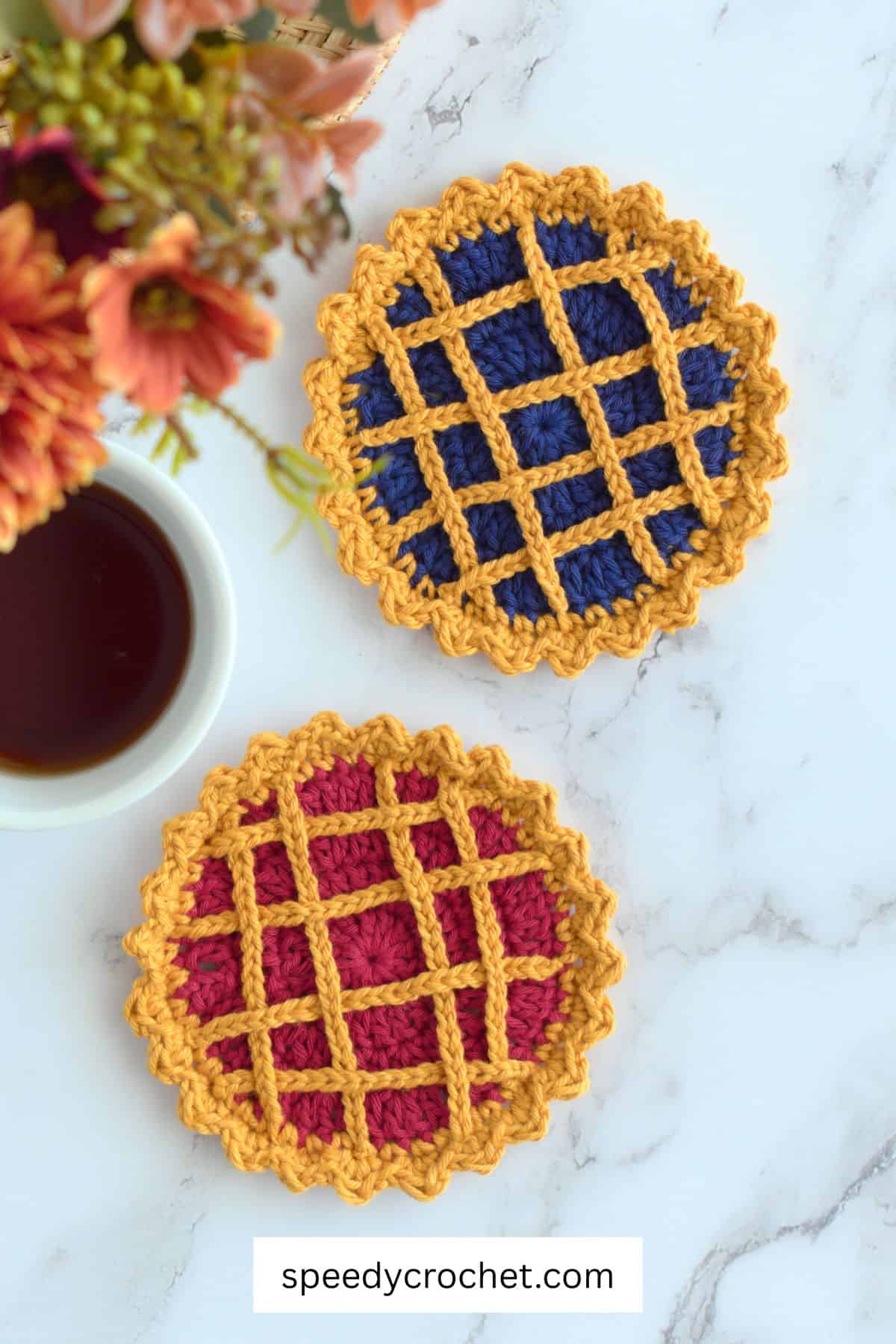 Two pie crochet coasters.