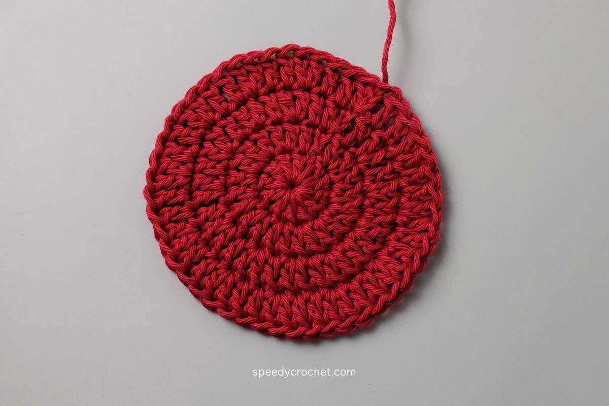 Red crochet circle.