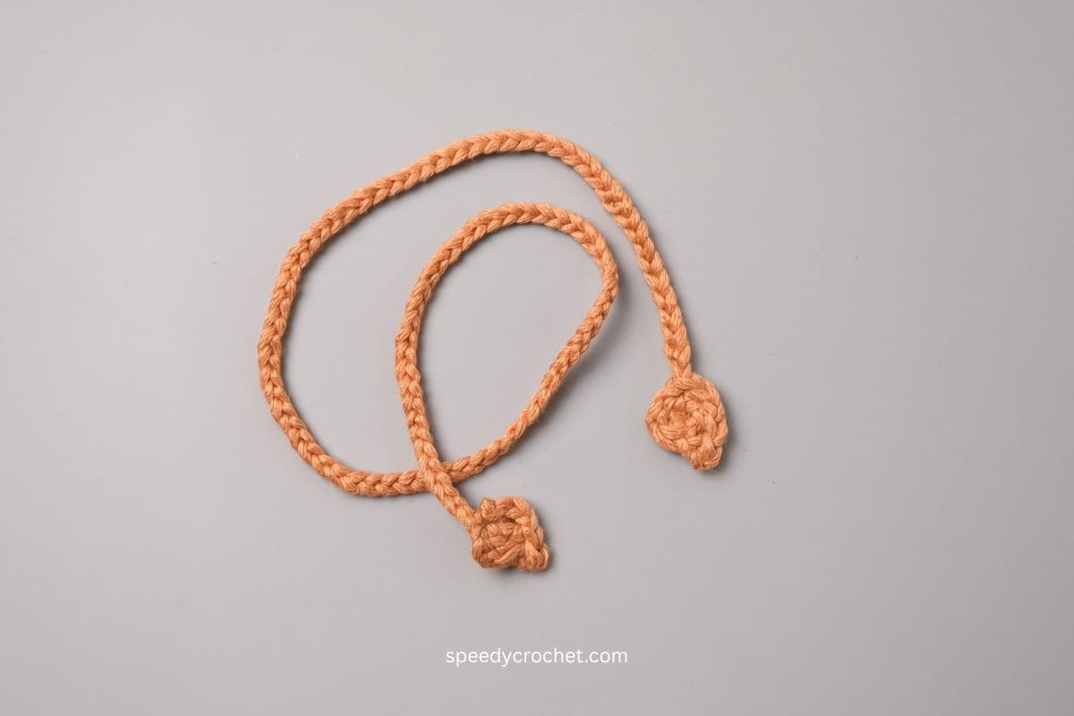 Crochet chain for a drawstring bag tie.