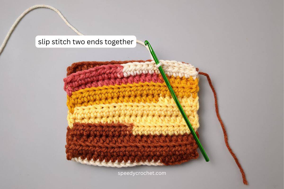 Joining side seams on a crochet rectangle.