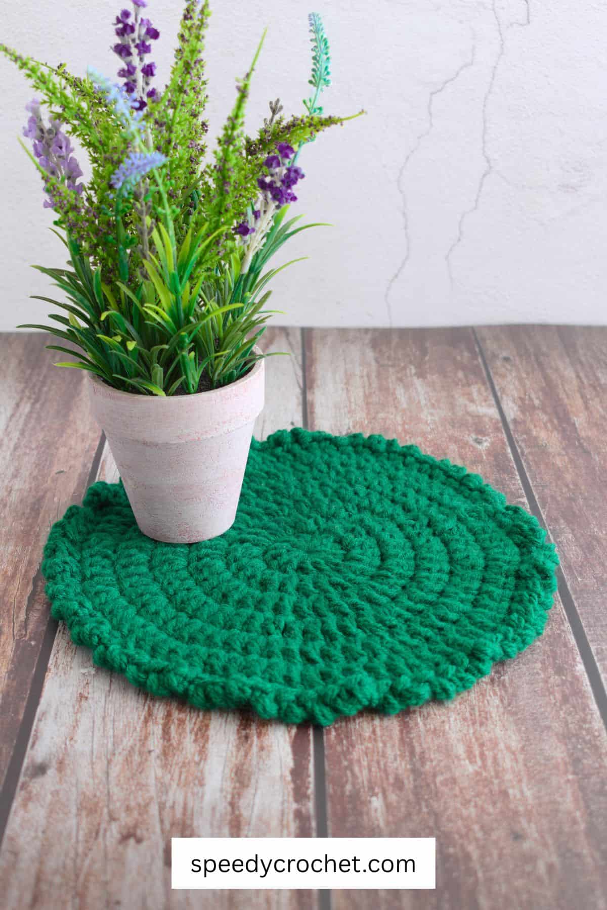 Green crochet round table mat,